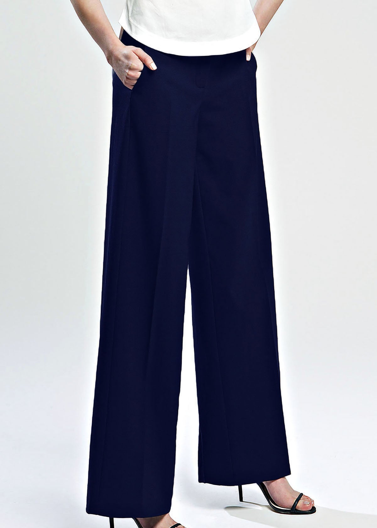 Navy wide-leg pants worn by a person on a white background