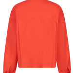 Back view of an orange shirt on a white background