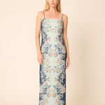 Woman wearing a floral dress on a beige background