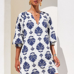 woman in printed mini dress outside 