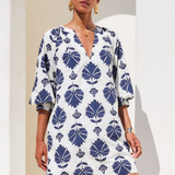 woman in printed mini dress outside 