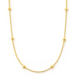 Gold necklace with small beads on a white background
