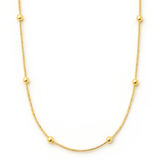 Gold necklace with small beads on a white background