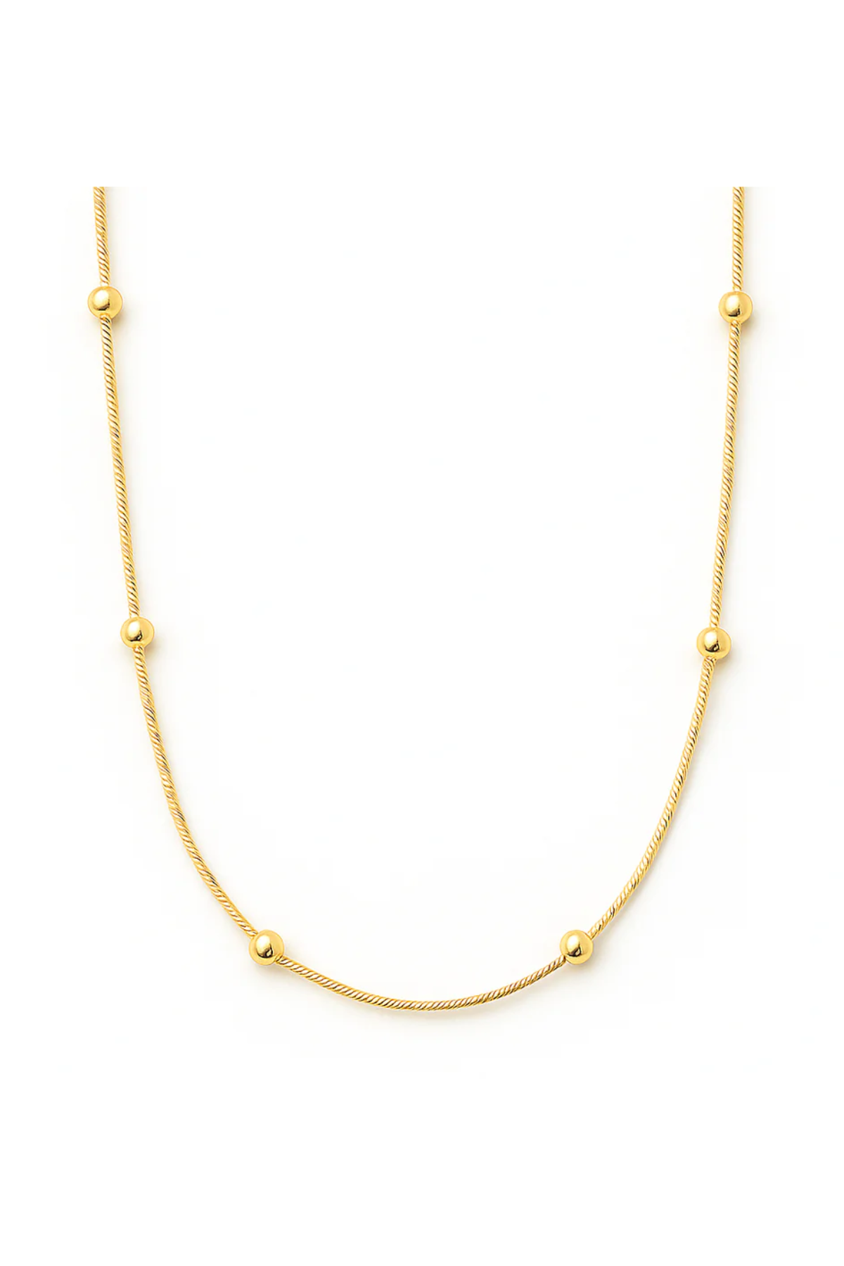 Gold necklace with small beads on a white background