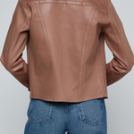 Model wearing a light-wash slim-fit denim jacket with raw hem detailing and a button-front design.