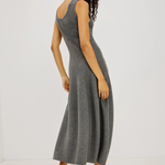 A woman modeling a sleeveless, scoop-neck gray knit midi dress, shown from a three-quarters back angle against a plain white studio background.