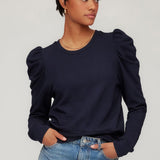 Top with puff sleeves and a clean, modern silhouette