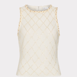 An off-white sleeveless knit top with a gold geometric diamond pattern and gold trim along the shoulder edges, shown against a light gray background.