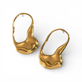 Pair of gold earrings on a white background