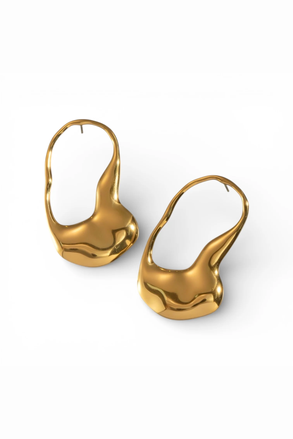 Pair of gold earrings on a white background