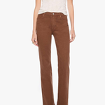 A model wearing brown straight-leg corduroy pants, a light beige short-sleeve knit top, and green snakeskin-patterned shoes, standing against a plain white background.
