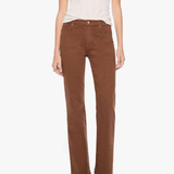 A model wearing brown straight-leg corduroy pants, a light beige short-sleeve knit top, and green snakeskin-patterned shoes, standing against a plain white background.