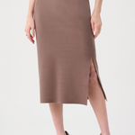 Woman wearing a brown skirt with a slit on a white background