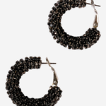 Black beaded hoop earrings on a white background.