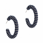 A pair of open hoop earrings with a textured spiral pattern in navy blue and silver, shown on a plain white background.