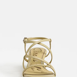 yellow strappy sandal on a white background