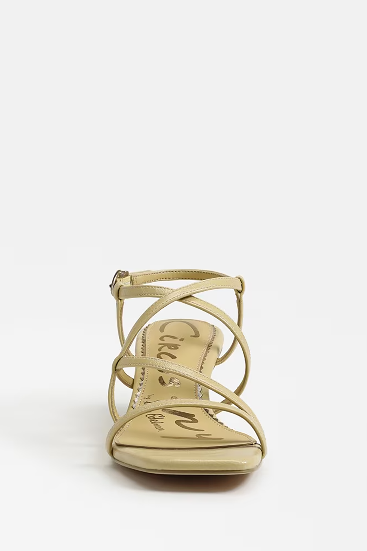 yellow strappy sandal on a white background