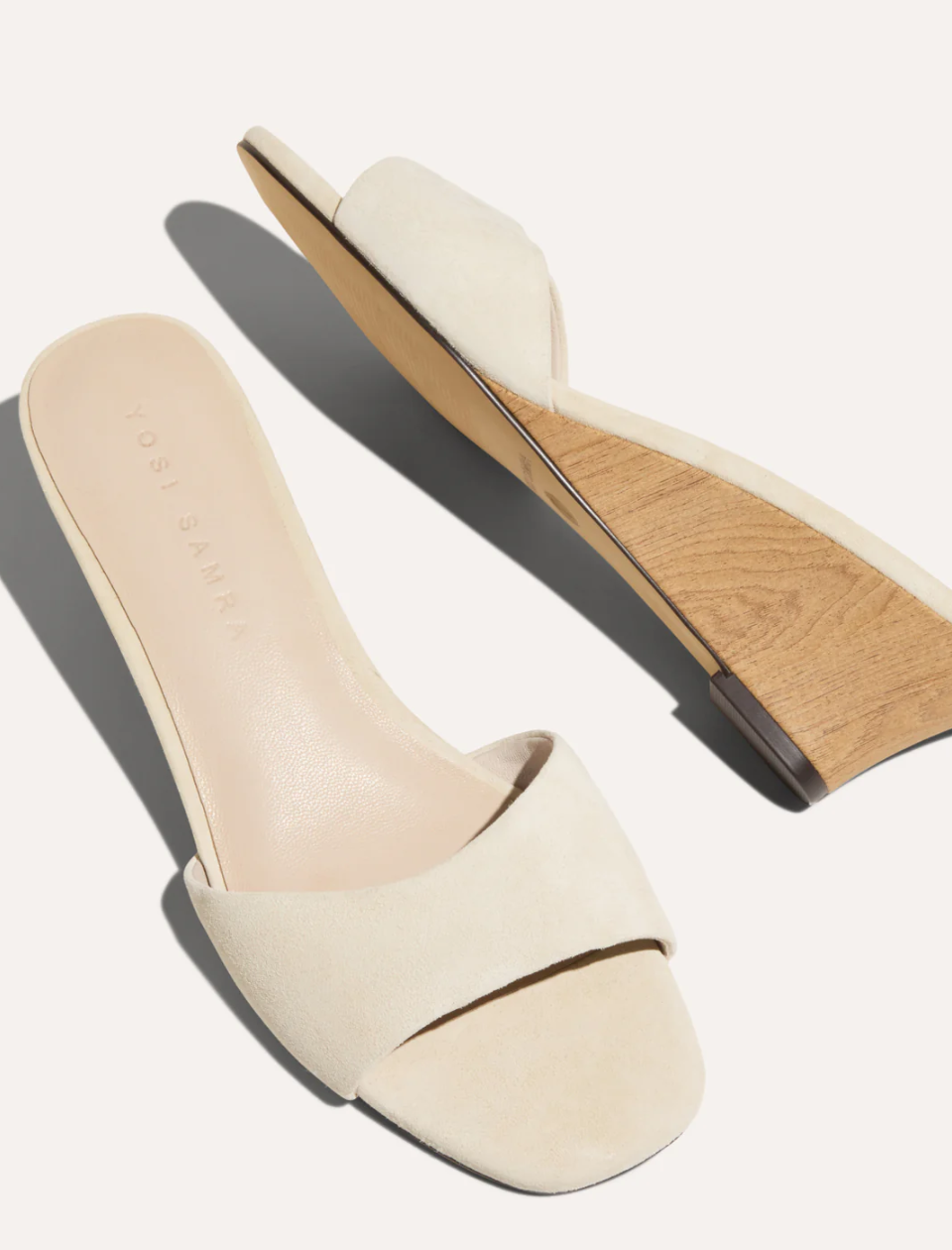 cream wedge sandals on white background 