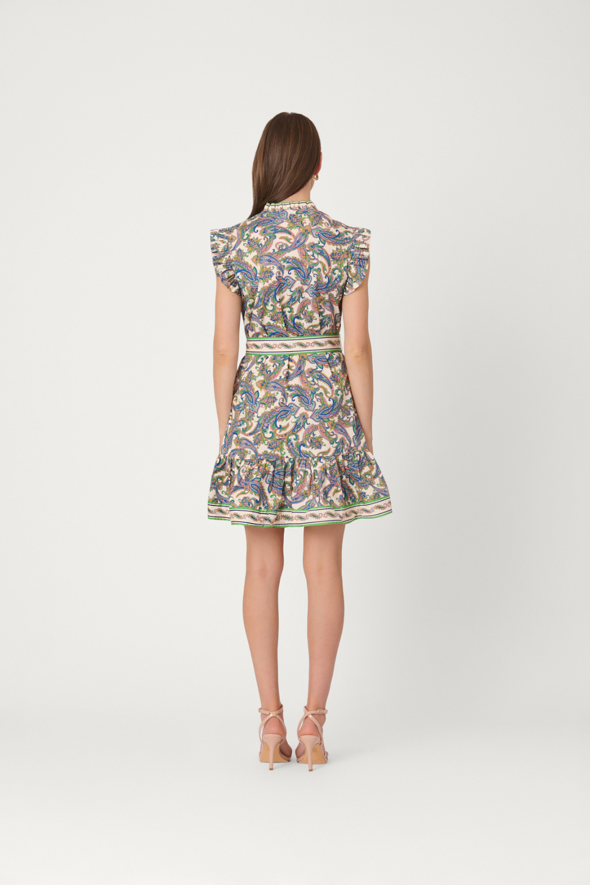 Woman wearing a floral dress on a white background