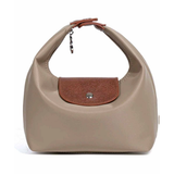 Beige handbag with a brown flap on a white background