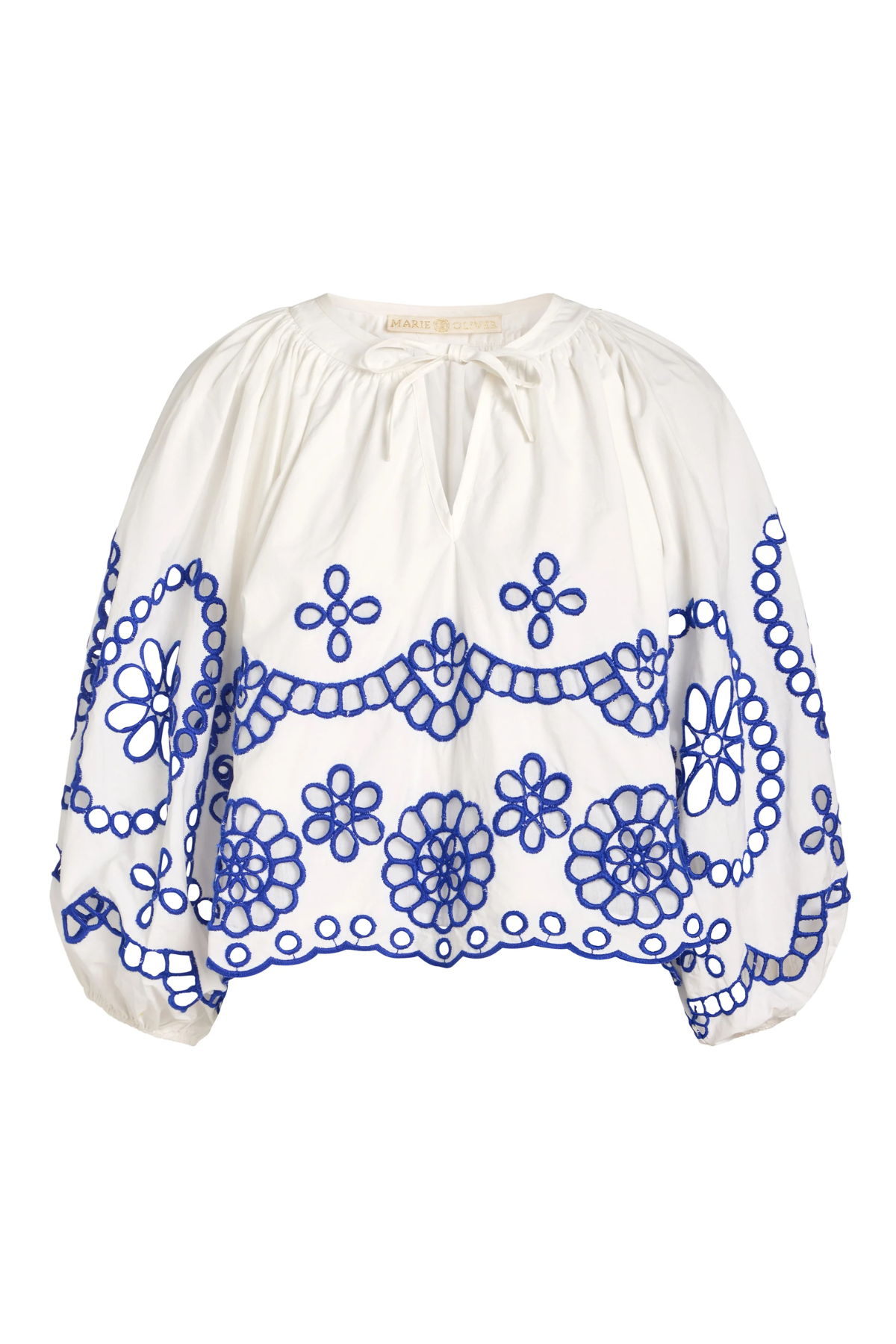 White blouse with blue floral embroidery on a white background