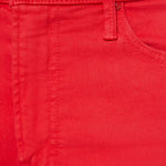 Close-up of a red fabric with a button and stitching details.