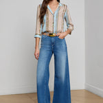 Three-quarter sleeve blouse with a soft stripe pattern.