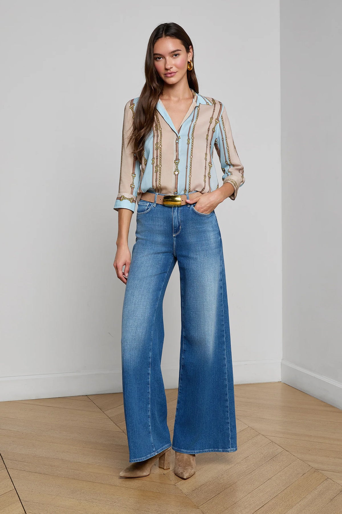 Three-quarter sleeve blouse with a soft stripe pattern.