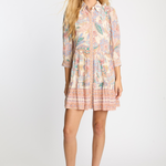 Woman wearing a floral dress on a white background