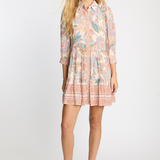 Woman wearing a floral dress on a white background