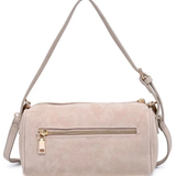 A light beige faux suede shoulder bag with a top zip closure, a front zippered pocket with a gold-tone pull, and a matching adjustable shoulder strap, shown against a plain white background.