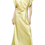 Woman wearing a light yellow satin dress on a white background