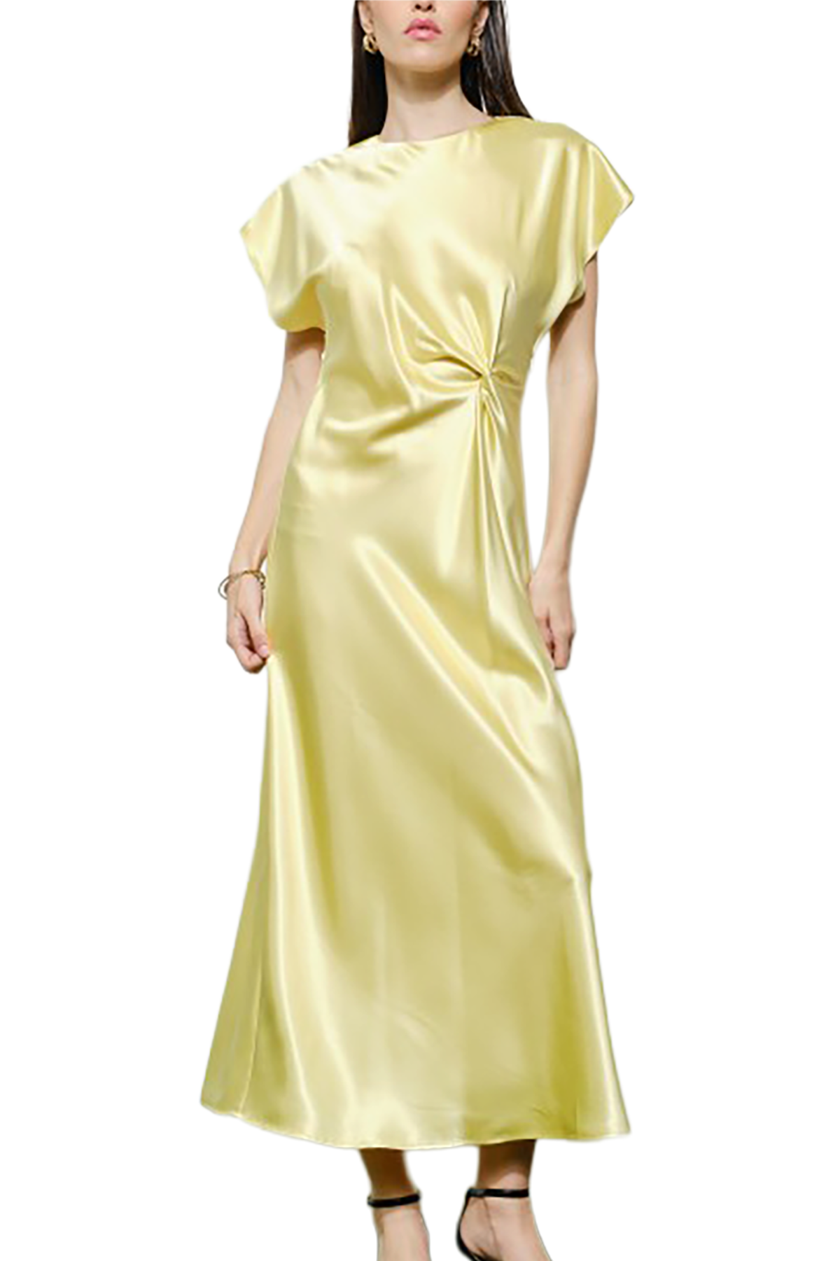 Woman wearing a light yellow satin dress on a white background