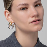Statement gold knocker earrings with sculptural design