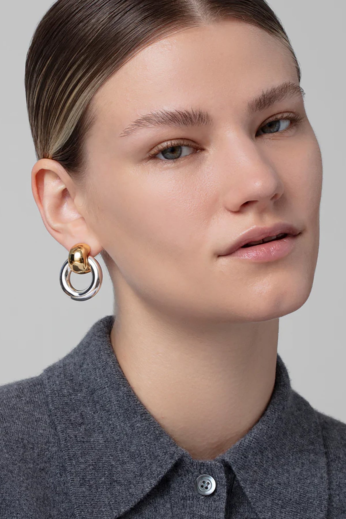 Statement gold knocker earrings with sculptural design