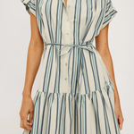 Woman wearing a striped dress with a white background