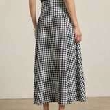 woman in checkered gingham midi skirt 