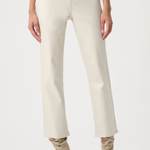 A model wearing a pair of off-white, straight-leg cropped jeans with beige suede boots, shown from the waist down against a plain white studio background.