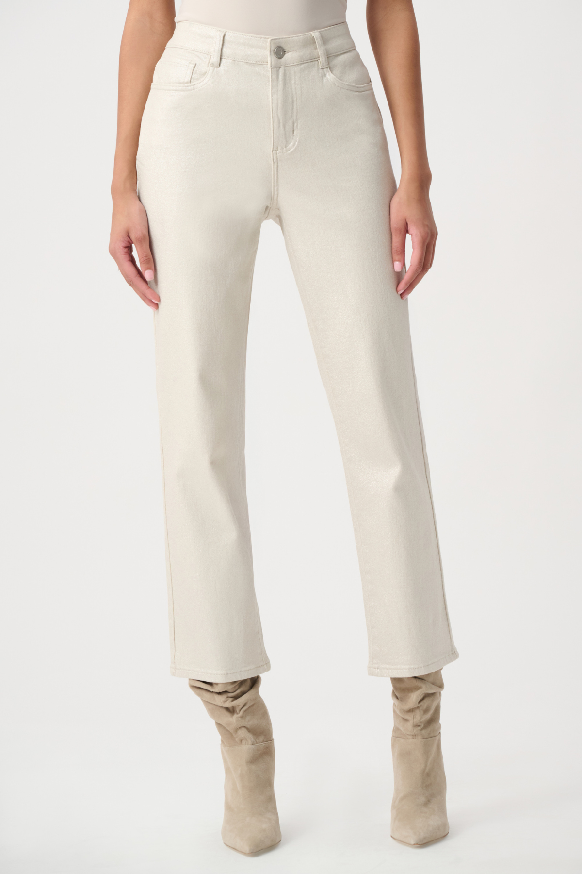 A model wearing a pair of off-white, straight-leg cropped jeans with beige suede boots, shown from the waist down against a plain white studio background.