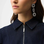 Woman wearing a indigo denim  dress with a belt on a white background