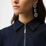 Woman wearing a indigo denim  dress with a belt on a white background