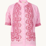 Pink blouse with intricate red embroidery on a white background