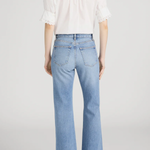 Model wearing Ivory popover blouse with a relaxed fit and clean minimalist styling.