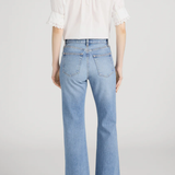 Model wearing Ivory popover blouse with a relaxed fit and clean minimalist styling.