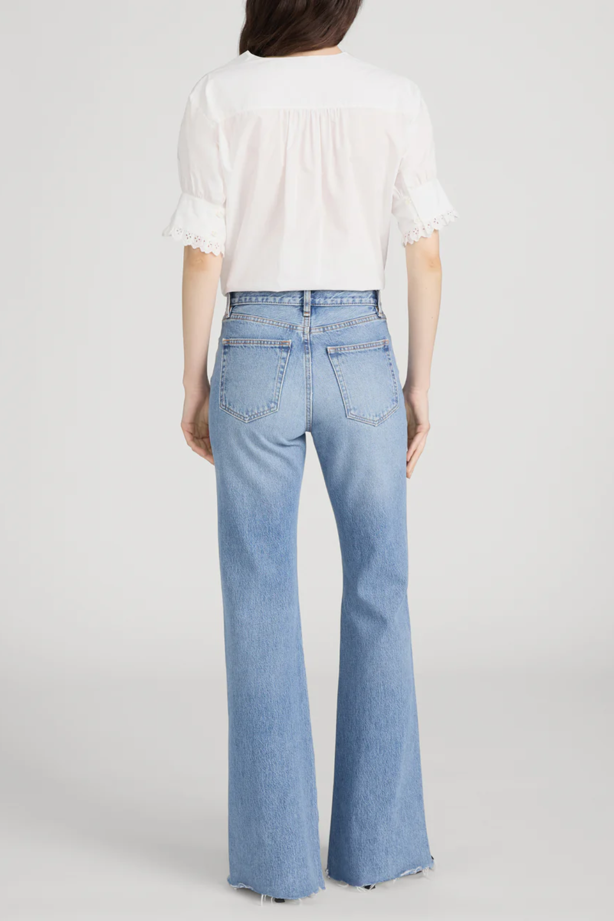 Model wearing Ivory popover blouse with a relaxed fit and clean minimalist styling.