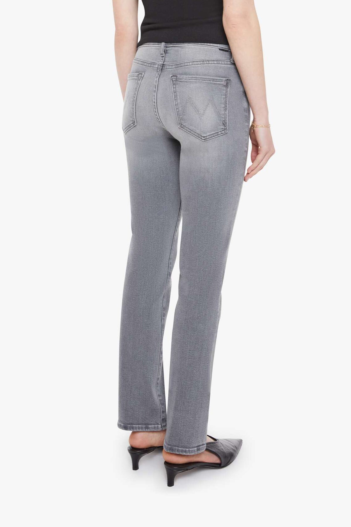 Woman wearing grey straight-leg jeans with a soft, structured fit and clean lines