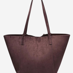 A large structured tote bag in a deep plum purple faux suede material, featuring two shoulder straps, shown against a plain light gray background.
