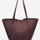 A large structured tote bag in a deep plum purple faux suede material, featuring two shoulder straps, shown against a plain light gray background.
