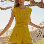 woman in green set outside 