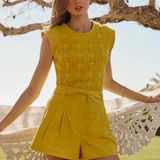 woman in green set outside 